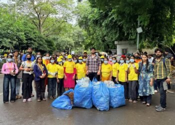 Maid In India Leads Cleanliness Drive at Delhi Protest Site. Yellow T-Shirts, Blue Bags, One Mission.