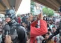 Batman Costume at Student Protest Goes Viral Across Social Media